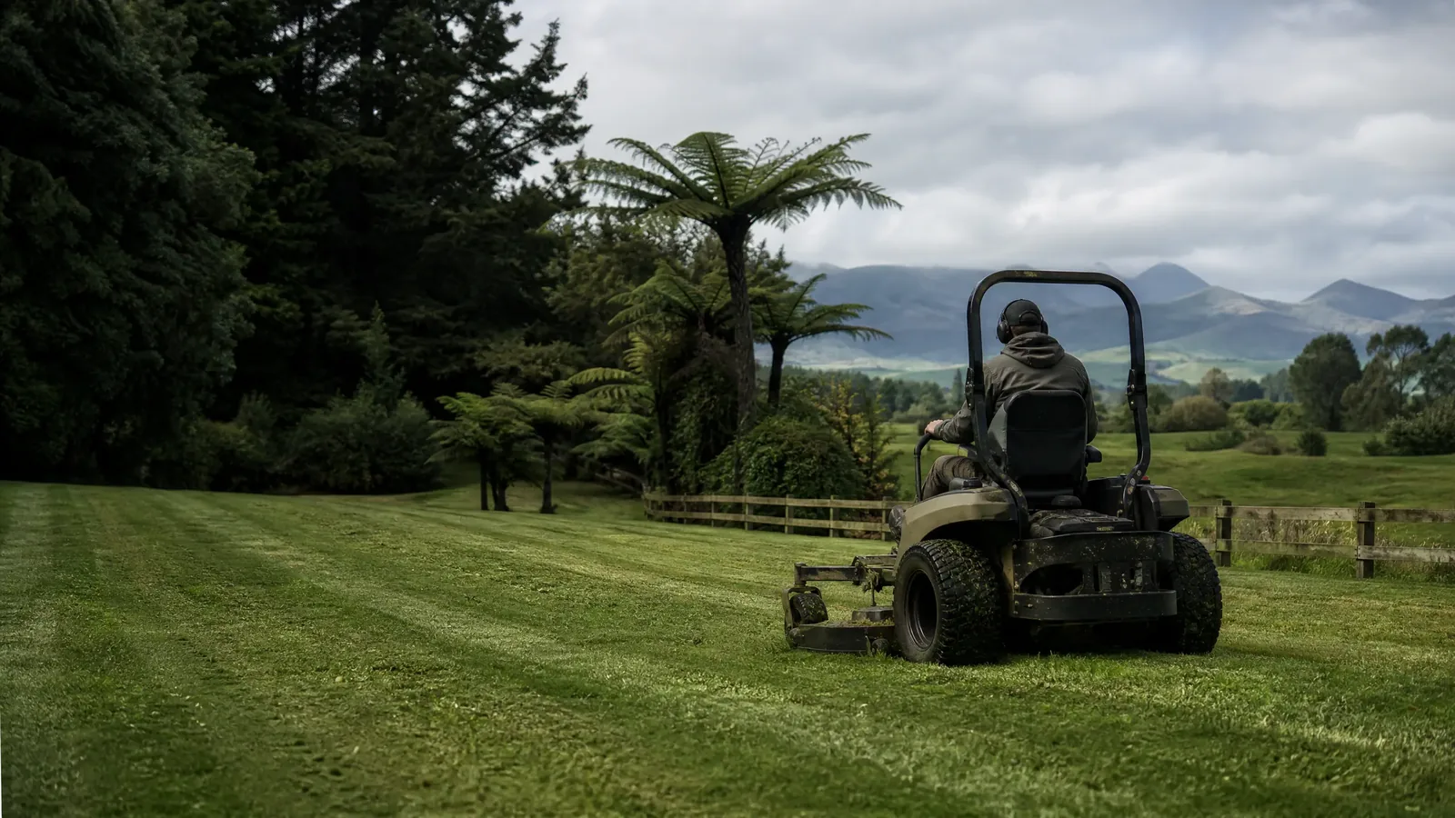 Commercial mower working on a large New Zealand lifestyle property